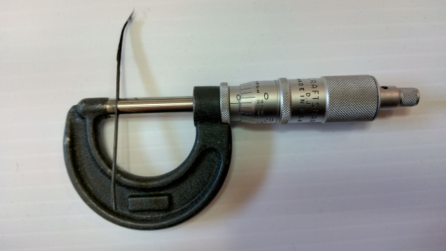 xx_After removal_shim bonded to bottom of saddle measures .024 thousands inch thick.jpg